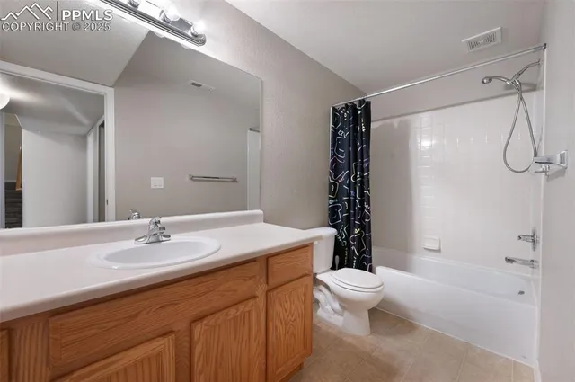 a bathroom with a sink toilet tub and shower