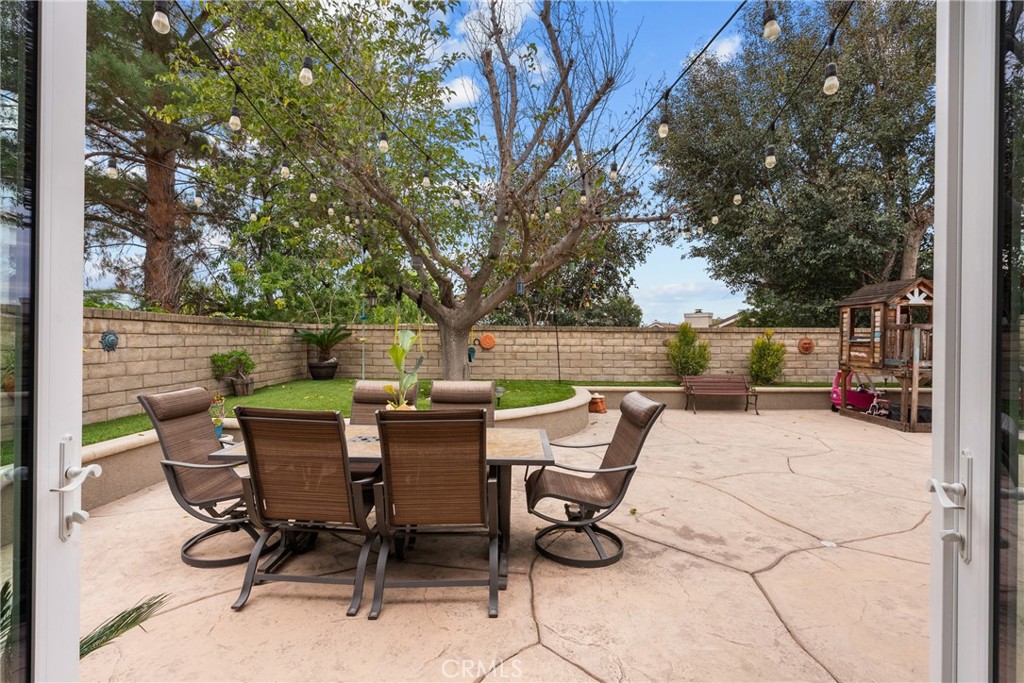 27251 Blakely Place Valencia, CA 91354 - Photo 13 of 31 a view of chair and tables in the patio