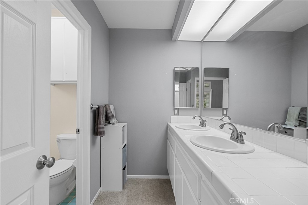 27251 Blakely Place Valencia, CA 91354 - Photo 21 of 31 a bathroom with a sink toilet and shower