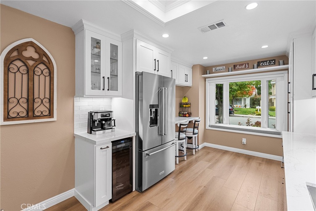 27251 Blakely Place Valencia, CA 91354 - Photo 9 of 31 a kitchen with stainless steel appliances granite countertop a refrigerator and a stove top oven