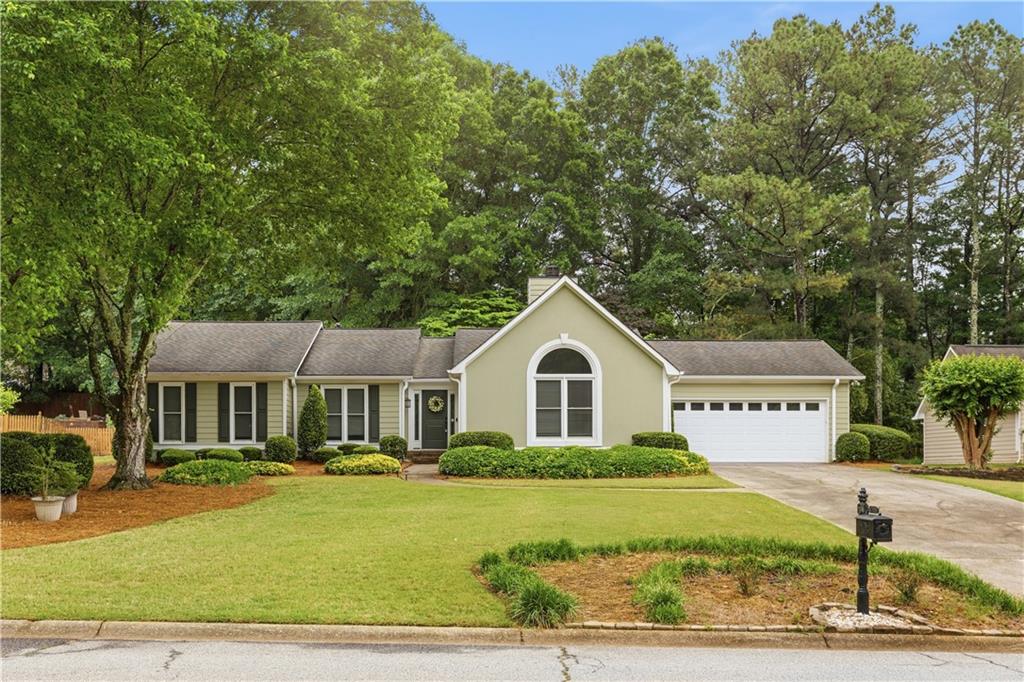 2824 Carriage Rowe Duluth, GA 30096 - Photo 1 of 45 a front view of a house with a yard