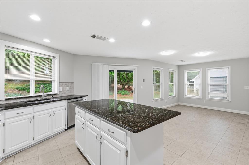 2824 Carriage Rowe Duluth, GA 30096 - Photo 17 of 45 a kitchen with sink stove and cabinets