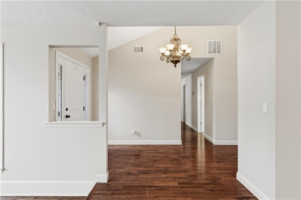 2824 Carriage Rowe Duluth, GA 30096 - Photo 18 of 45 a view of an entryway with wooden floor