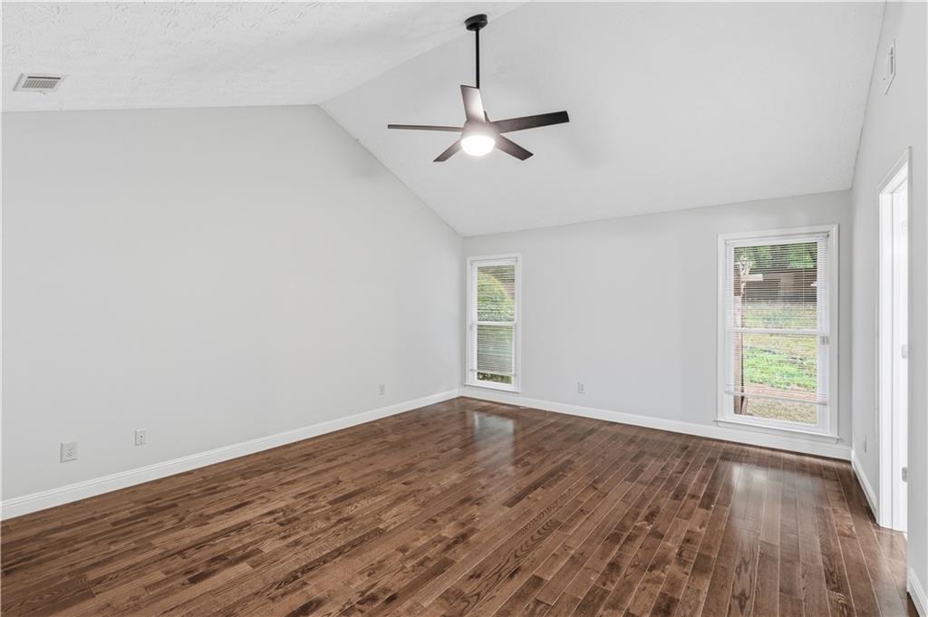 2824 Carriage Rowe Duluth, GA 30096 - Photo 19 of 45 wooden floor in an empty room with a window
