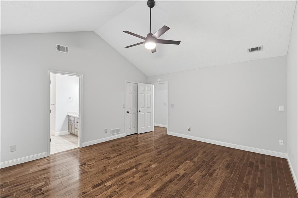 2824 Carriage Rowe Duluth, GA 30096 - Photo 20 of 45 a view of a room with wooden floor and ceiling fan