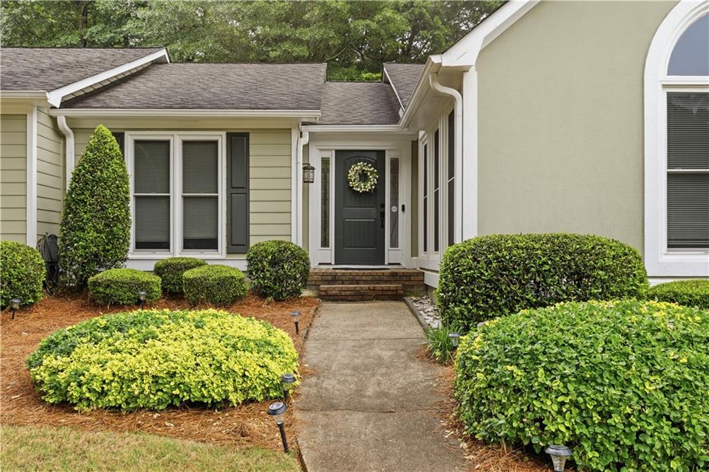 2824 Carriage Rowe Duluth, GA 30096 - Photo 3 of 45 a front view of a house with garden