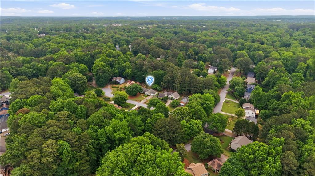 2824 Carriage Rowe Duluth, GA 30096 - Photo 44 of 45 an aerial view of a houses with a lush green hillside