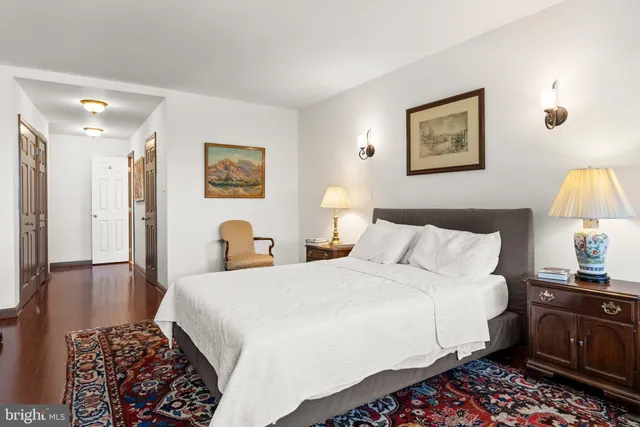 a bedroom with bed and a night stand