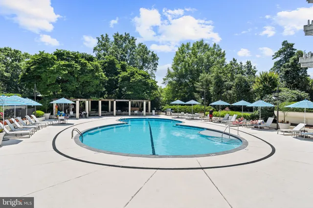 a view of pool with outdoor seating