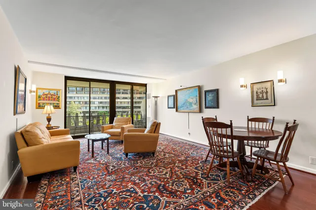 a dining room with furniture and wooden floor
