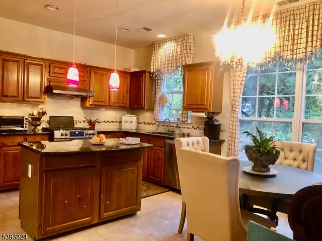 a kitchen with a sink cabinets and window