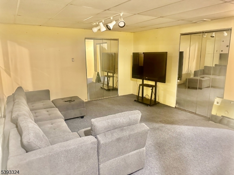 9 Winthrop Drive Somerville, NJ 08876 - Photo 9 of 10 a living room with furniture and a flat screen tv