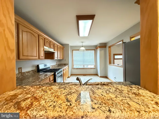 a bed room with a bed furniture and a flat tv screen