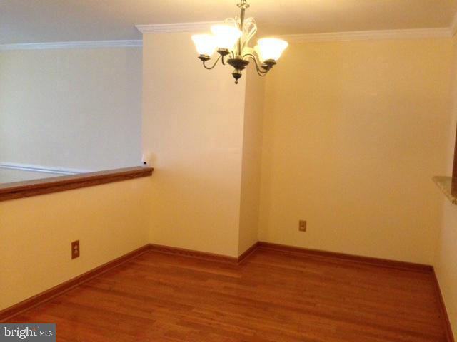 208 Rugby Road Fredericksburg, VA 22406 - Photo 4 of 4 a view of a room with wooden floor and a ceiling fan