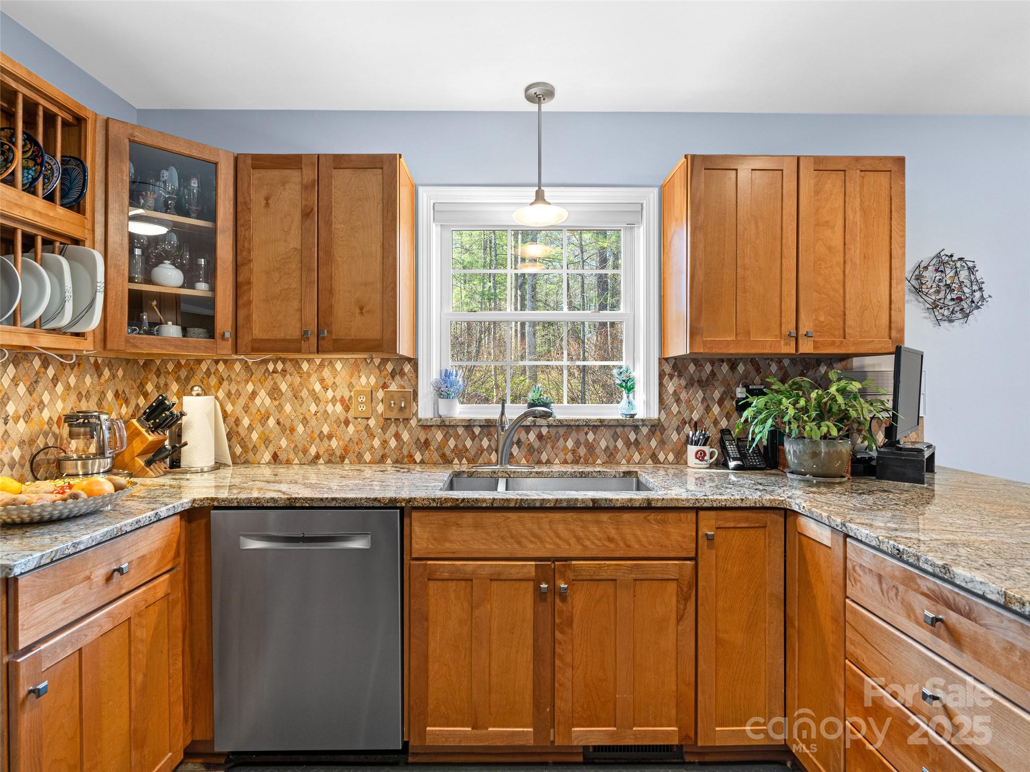 18 Tall Pines Trail Arden, NC 28704 - Photo 12 of 44 a kitchen with stainless steel appliances granite countertop wooden cabinets a sink and a large window