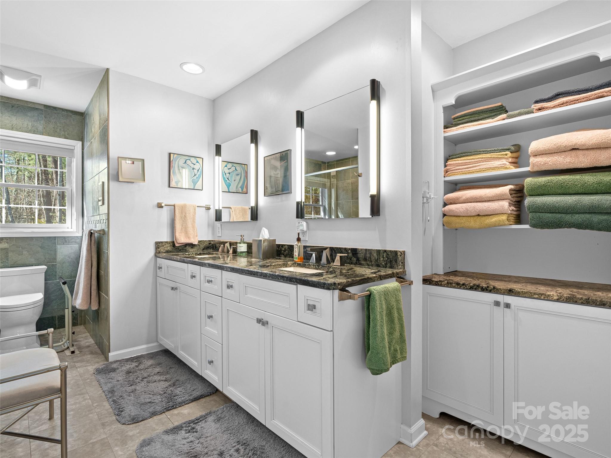 18 Tall Pines Trail Arden, NC 28704 - Photo 22 of 44 a spacious bathroom with a granite countertop sink and a mirror