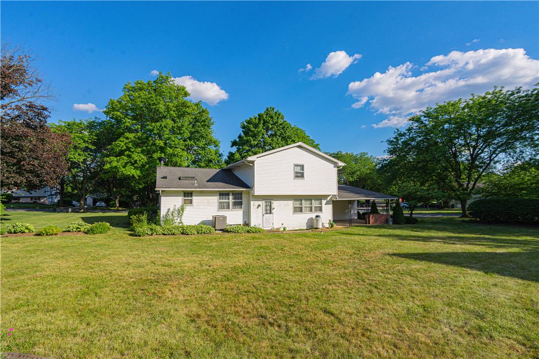 5425 Clauser Road Orefield, PA 18069 - Photo 14 of 18 A well-maintained lawn embraces this traditional home, offering ample outdoor space and shade from mature trees.