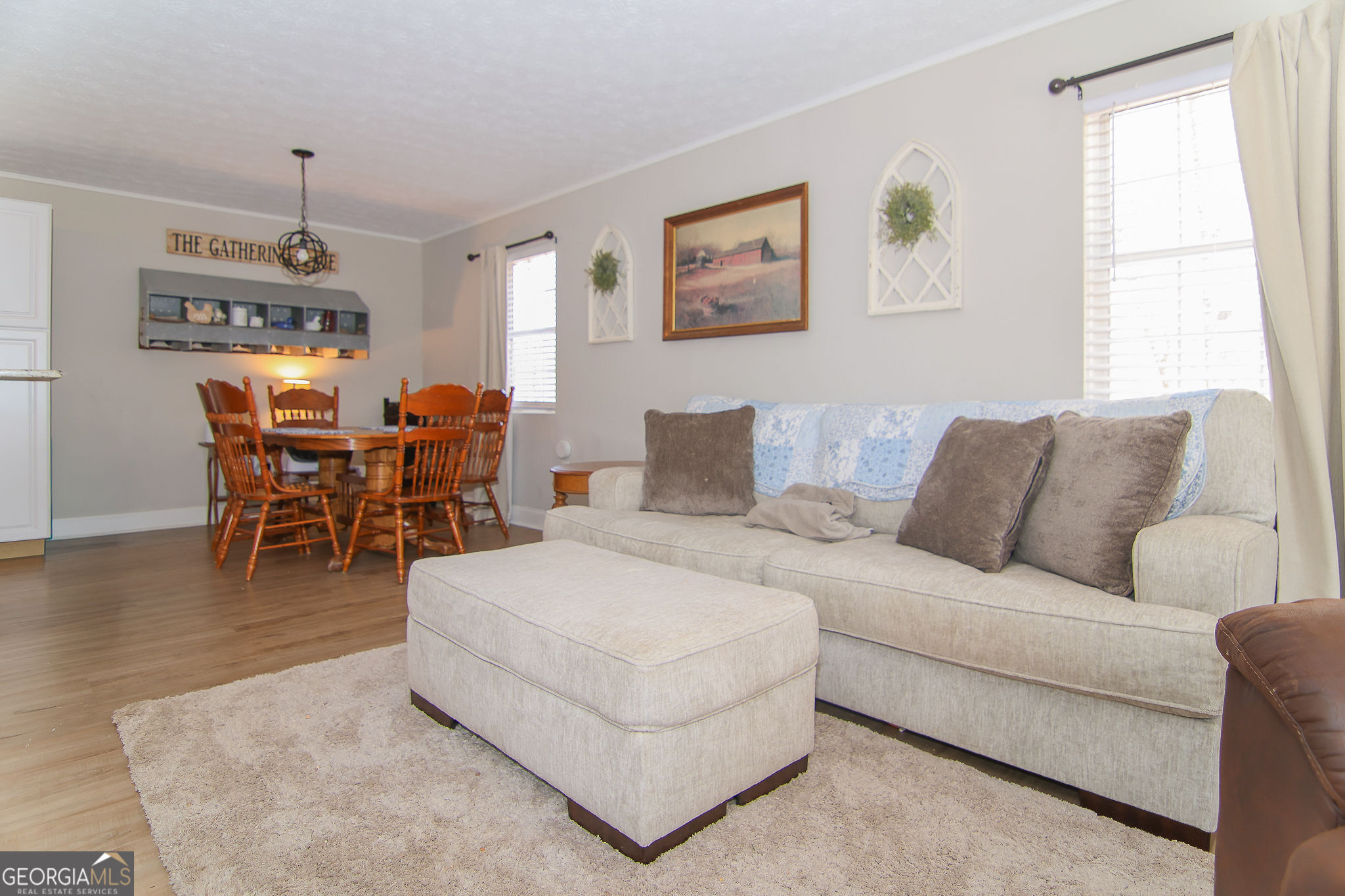 338 Young Road Franklin, GA 30217 - Photo 12 of 43 a living room with furniture a dining table and a window