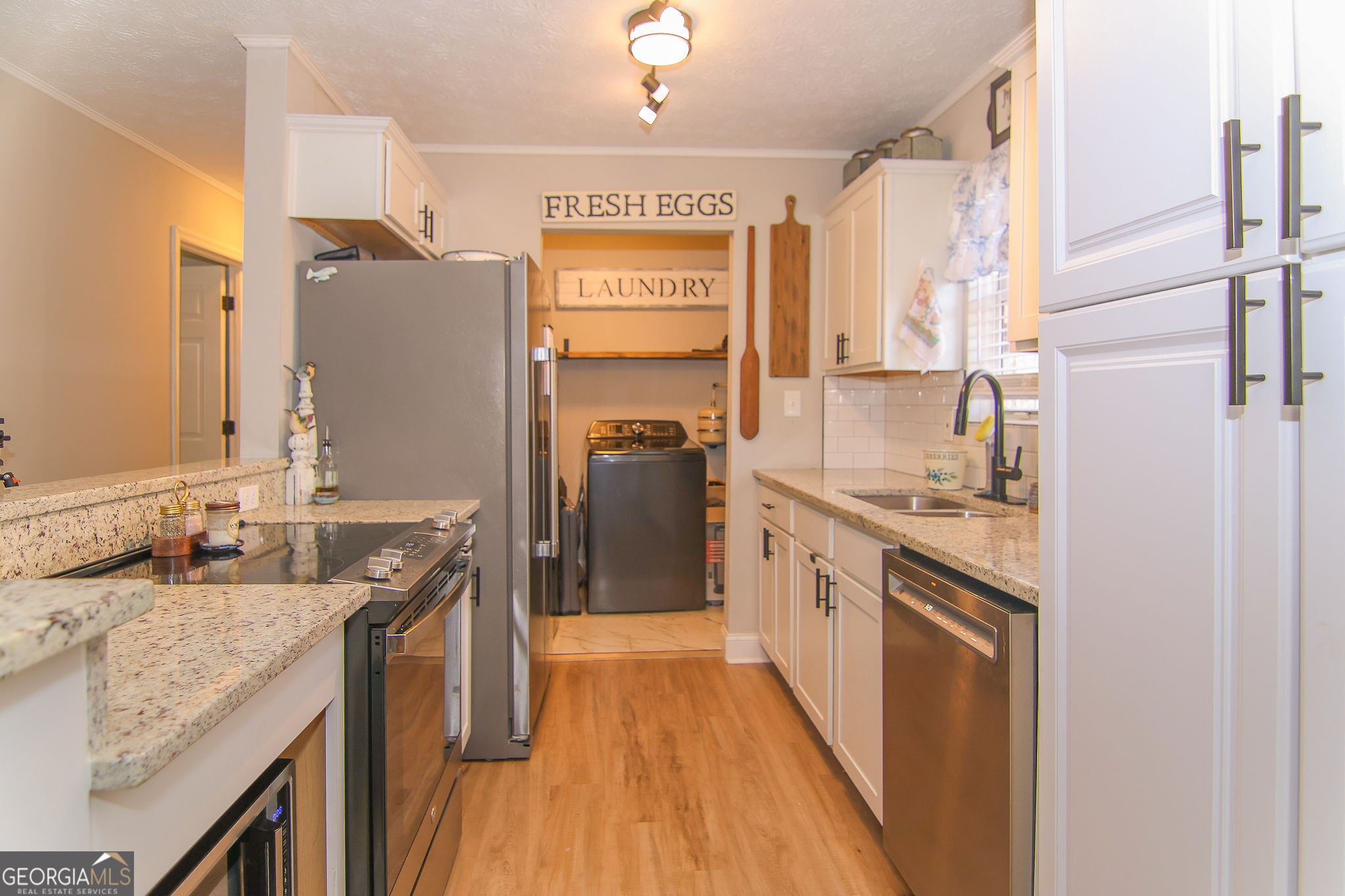 338 Young Road Franklin, GA 30217 - Photo 14 of 43 a kitchen with stainless steel appliances granite countertop a sink and a refrigerator