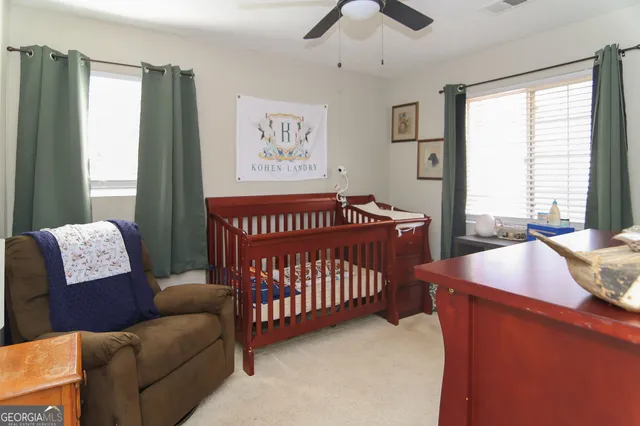 a bedroom with furniture and a window