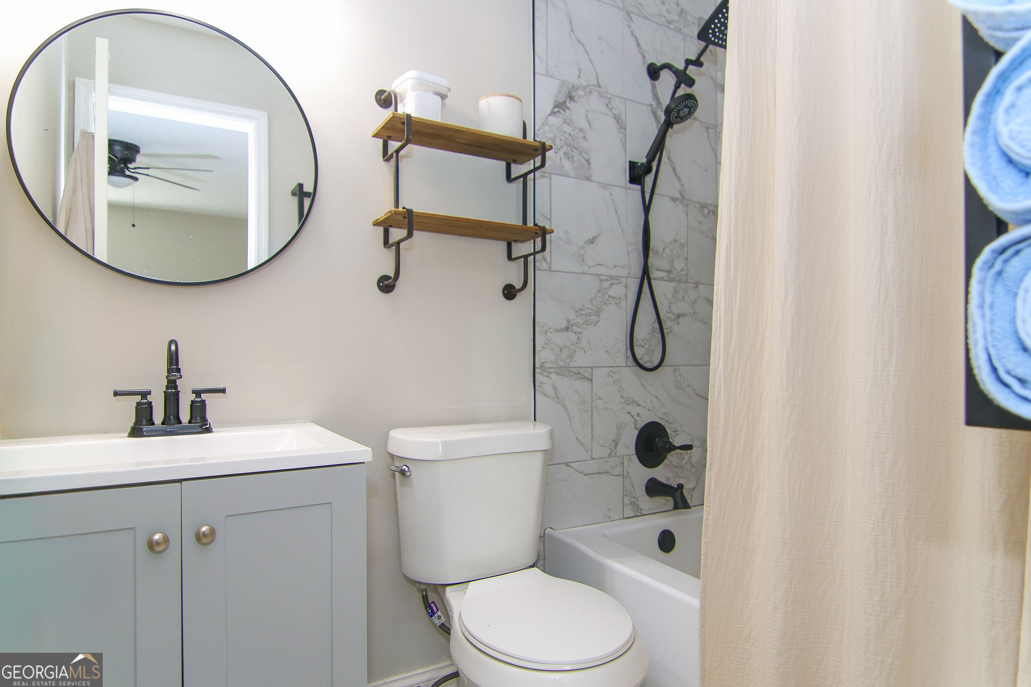338 Young Road Franklin, GA 30217 - Photo 24 of 43 a bathroom with a toilet a sink and a mirror