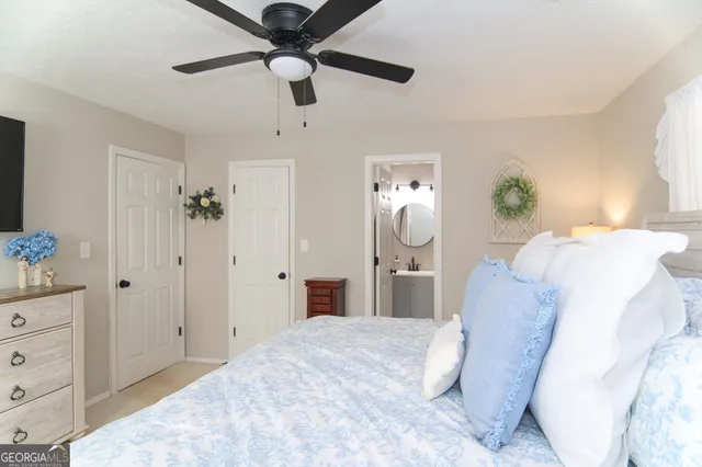 a bedroom with a bed and a dresser