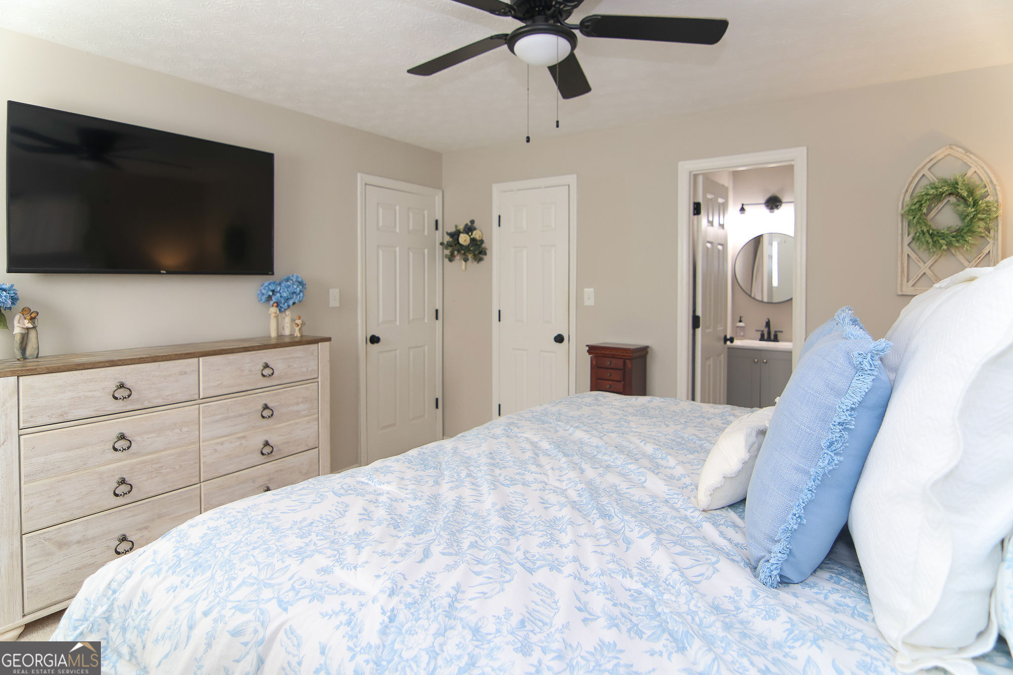 338 Young Road Franklin, GA 30217 - Photo 28 of 43 a bedroom with a bed and a flat screen tv