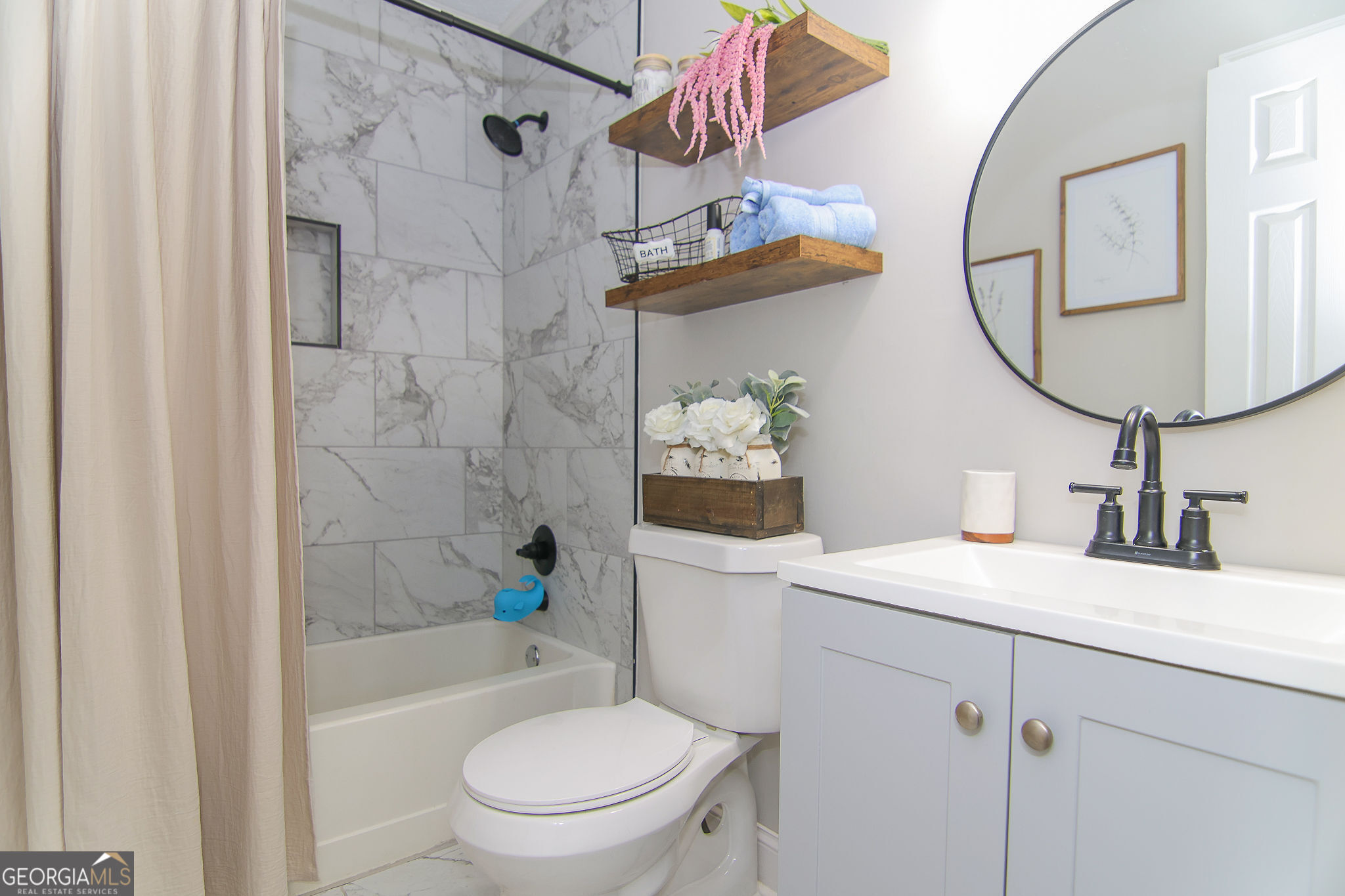 338 Young Road Franklin, GA 30217 - Photo 29 of 43 a bathroom with a sink toilet and shower