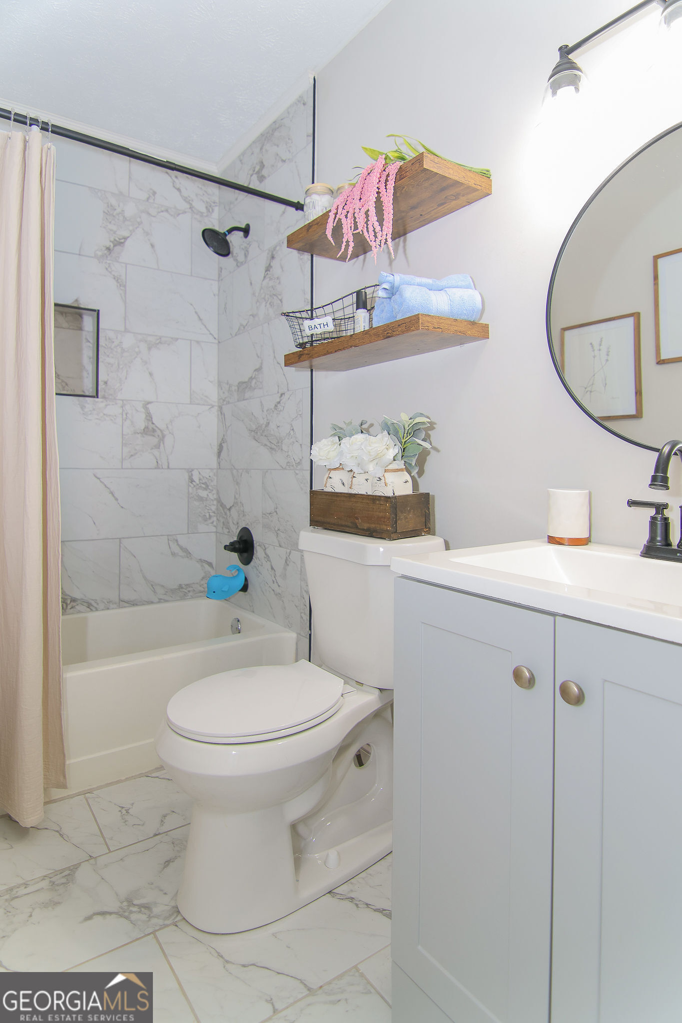 338 Young Road Franklin, GA 30217 - Photo 30 of 43 a bathroom with a sink a toilet and shower