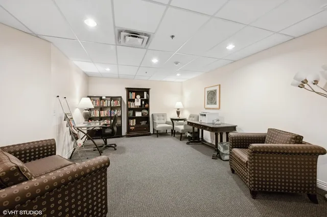 a living room with furniture a dining table and wooden floor