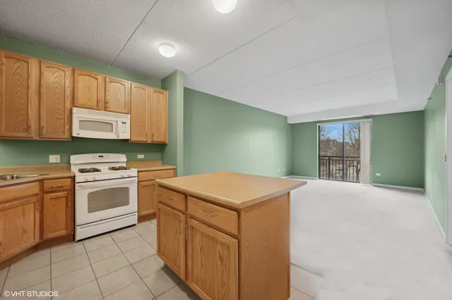 a kitchen with a stove top oven sink and cabinets