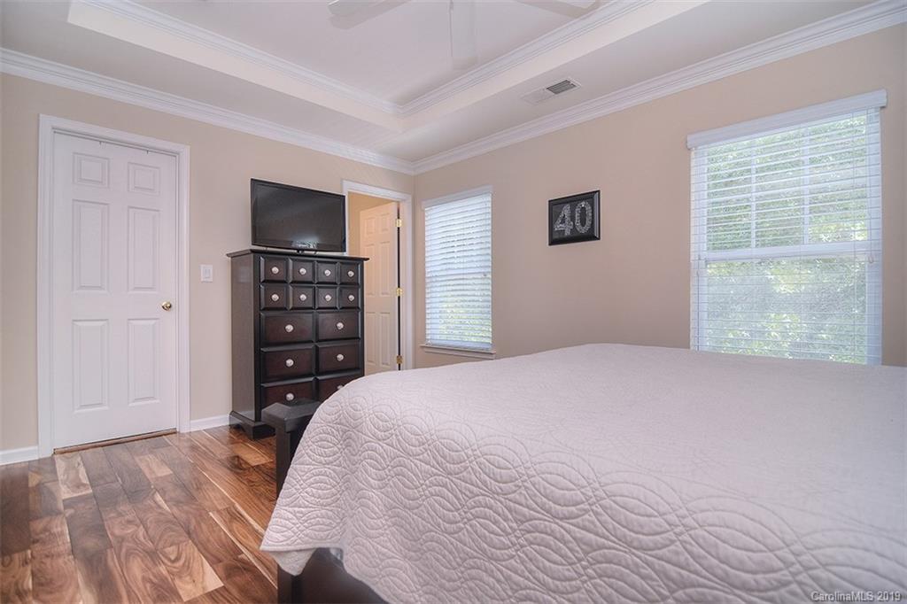 13219 Meadowmere Road Huntersville, NC 28078 - Photo 20 of 28 a bedroom with a bed and a television