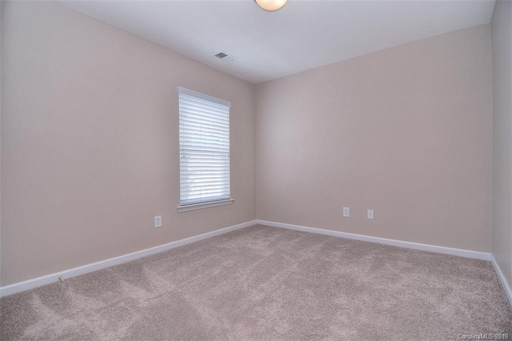 13219 Meadowmere Road Huntersville, NC 28078 - Photo 22 of 28 an empty room with windows and closet