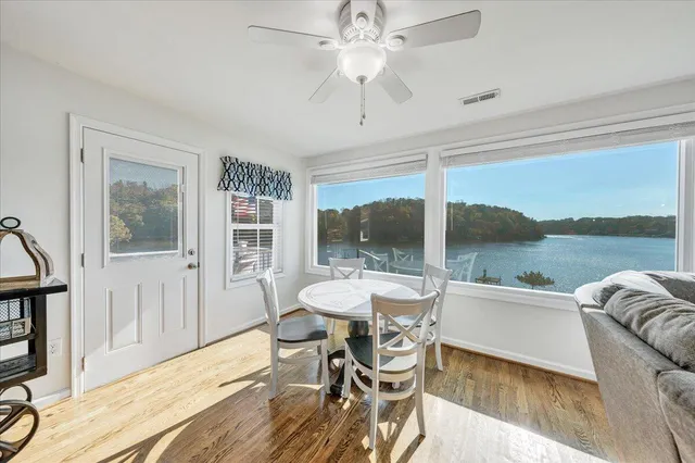 a dining room with furniture window wooden floor