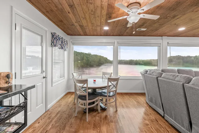 a bedroom with a bed and a ceiling fan