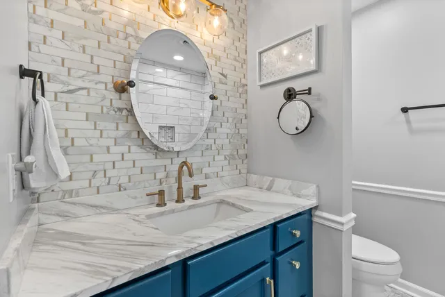 a view of a swimming pool with an outdoor seating space