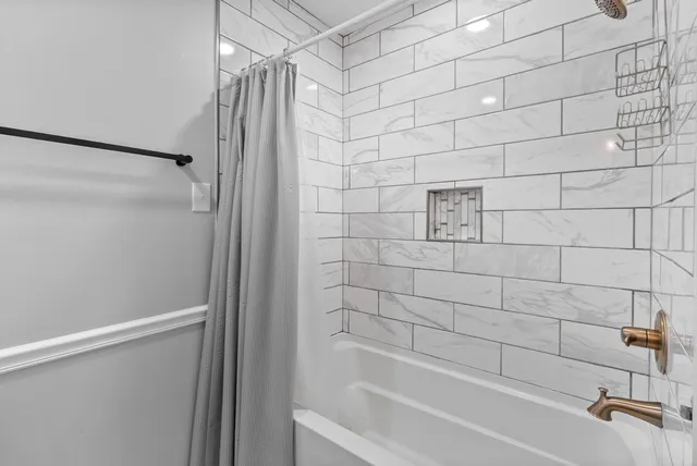 a view of a terrace with a table and chairs