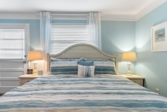 a small pool with lawn chairs next to a yard