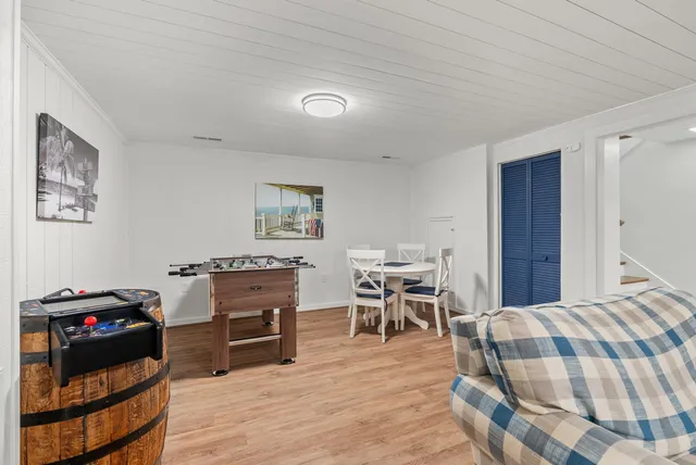 an aerial view of a house with a garden and lake view