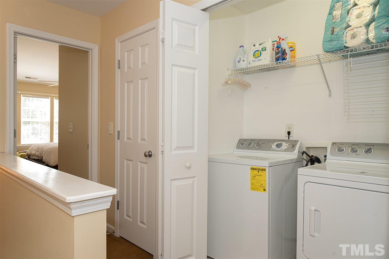 8272 City Loft Court Raleigh, NC 27613 - Photo 19 of 26 a utility room with dryer and washer