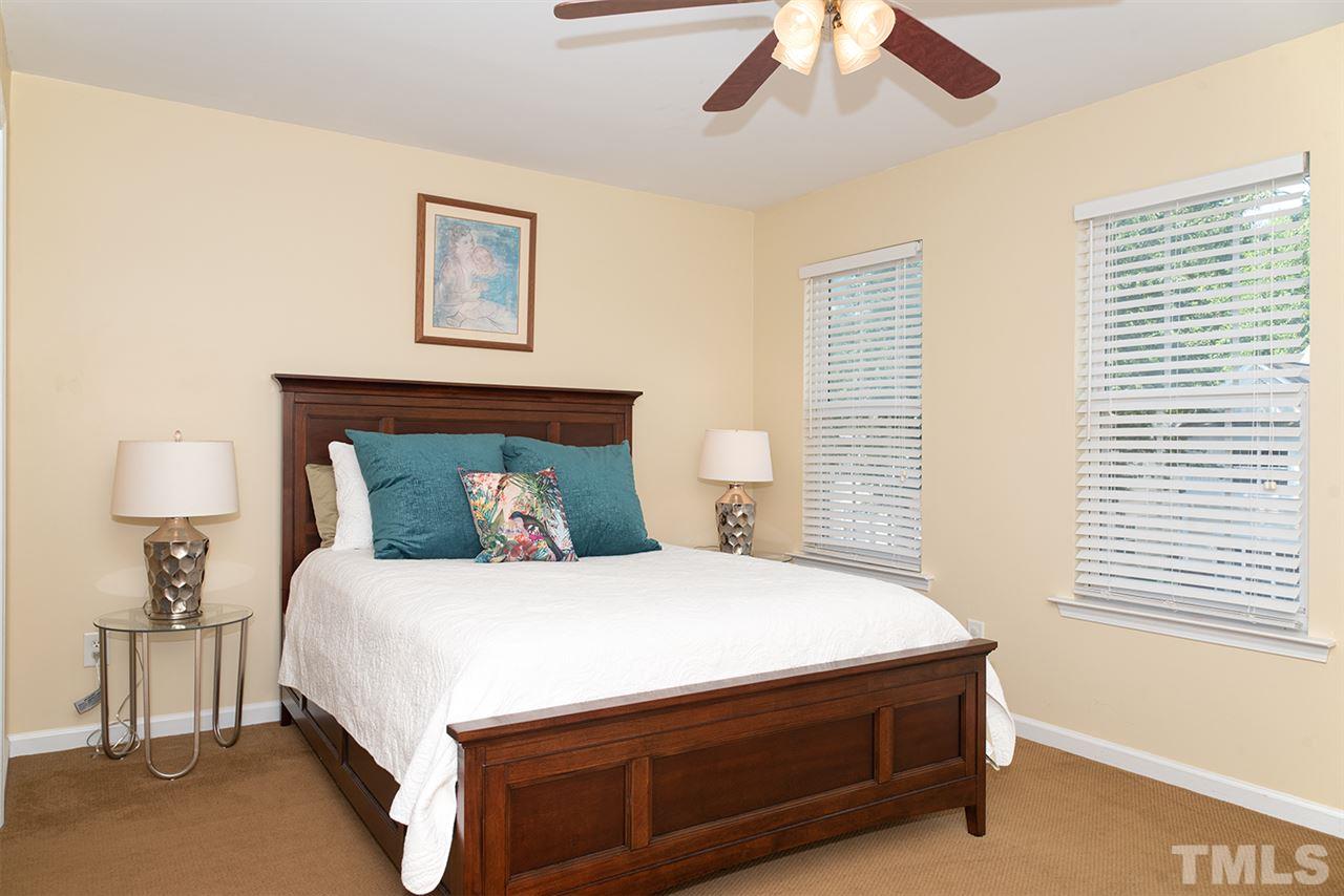 8272 City Loft Court Raleigh, NC 27613 - Photo 20 of 26 a bedroom with a bed and window