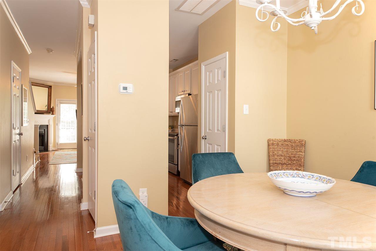8272 City Loft Court Raleigh, NC 27613 - Photo 3 of 26 a view of a dining room with furniture