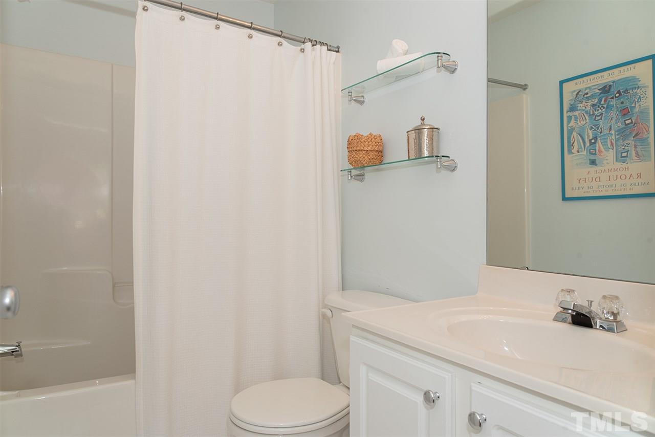8272 City Loft Court Raleigh, NC 27613 - Photo 23 of 26 a bathroom with a sink toilet and shower