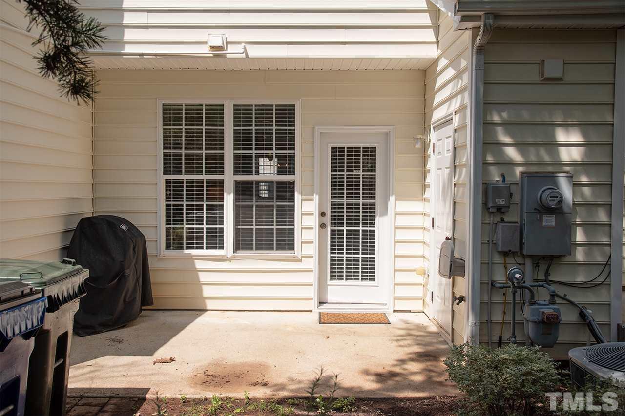 8272 City Loft Court Raleigh, NC 27613 - Photo 24 of 26 a front view of a house with a balcony