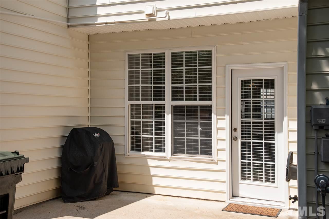 8272 City Loft Court Raleigh, NC 27613 - Photo 25 of 26 a view of a door with a chair