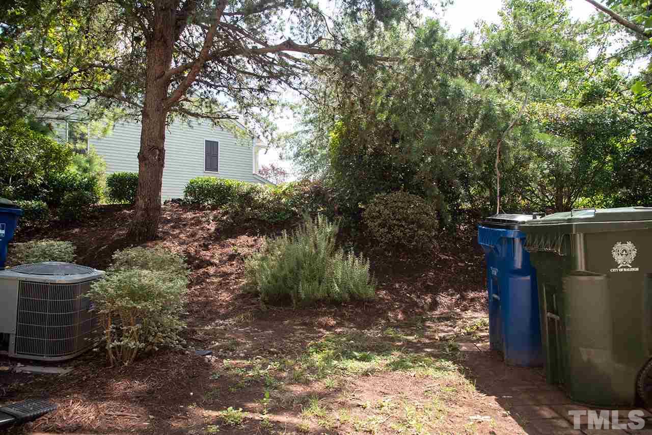 8272 City Loft Court Raleigh, NC 27613 - Photo 26 of 26 a view of a house with a yard and tree s