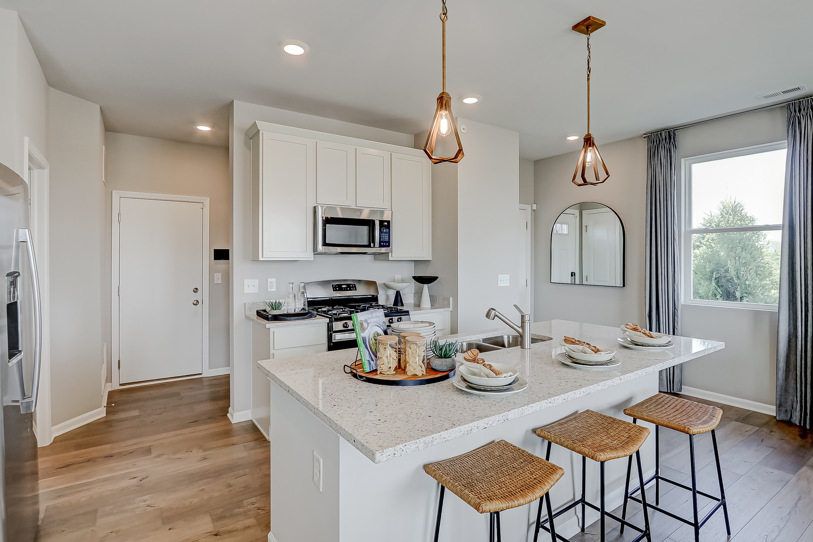 401 Comstock Road South Elgin, IL 60177 - Photo 15 of 34 a kitchen with sink refrigerator dining table and chairs