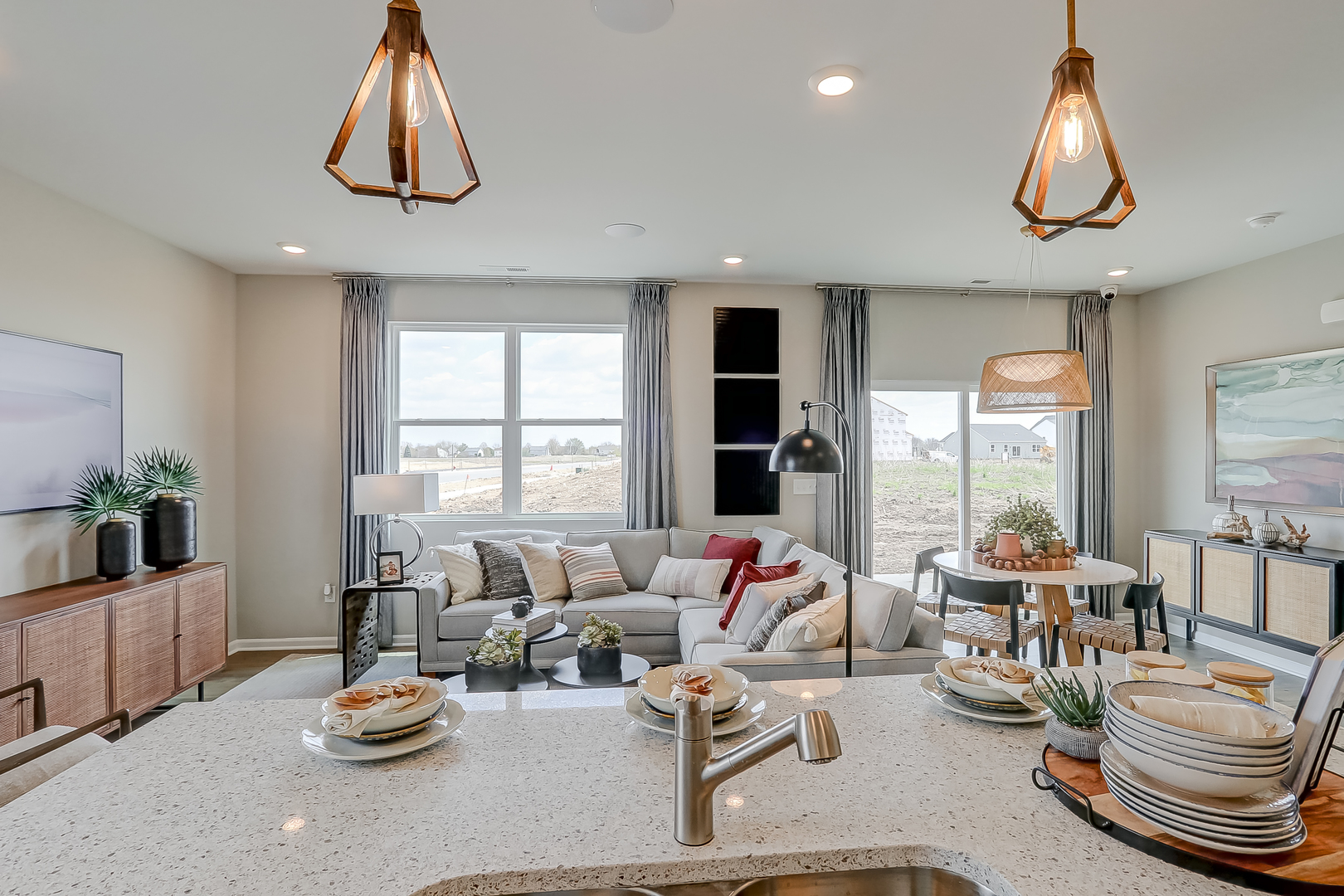 401 Comstock Road South Elgin, IL 60177 - Photo 17 of 34 a living room with furniture a chandelier and a large window