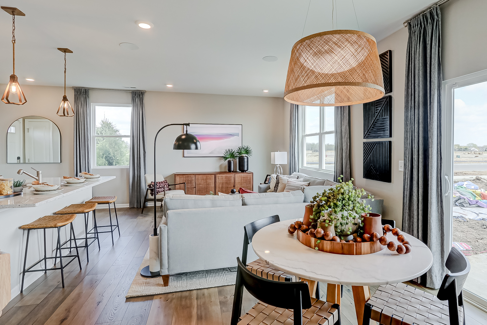 401 Comstock Road South Elgin, IL 60177 - Photo 19 of 34 a living room with furniture a table and kitchen chandelier
