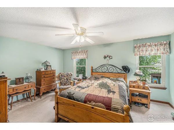 a bedroom with furniture and a window